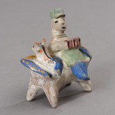 Игрушка «Мужчина на диване»